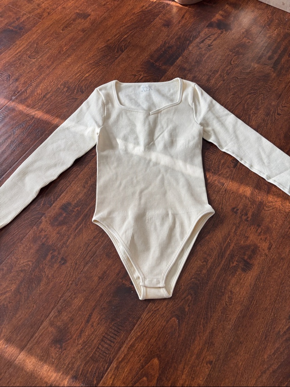 OGG Ribbed Long-Sleeve One-Piece Bodysuit in Cream